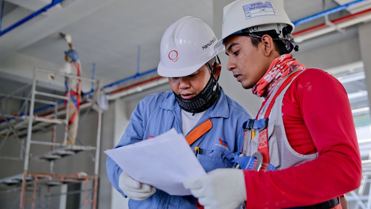 Homeowner reviewing roof plans before construction