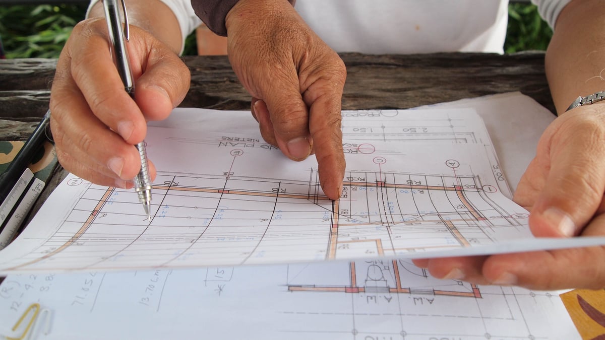 Homeowner and contractor reviewing a roofing estimate