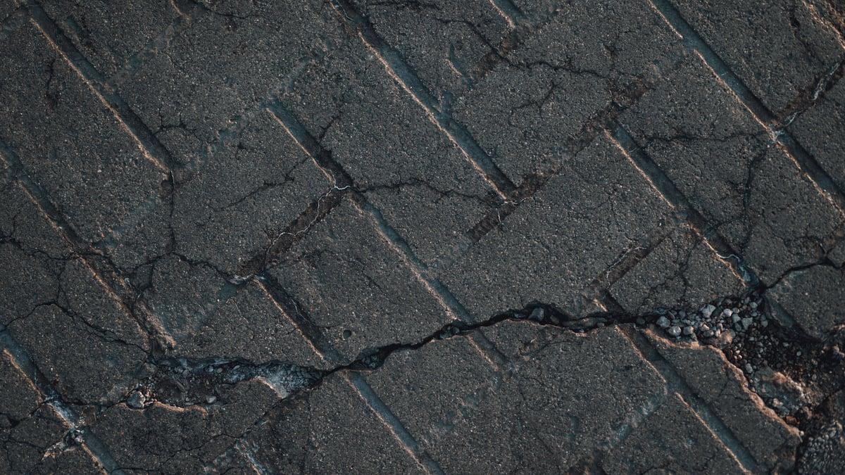 Close-up of damaged asphalt shingles for repair