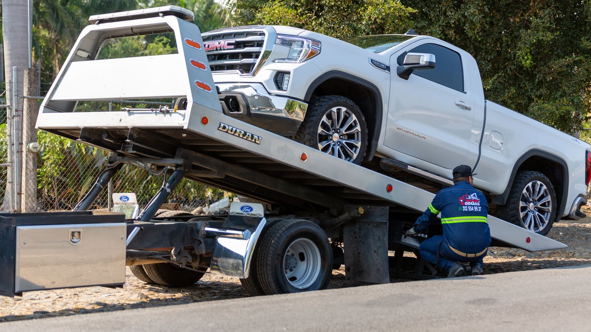 Vehicle being towed slowly on a road