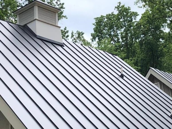 Metal standing-seam roof with a cupola against
