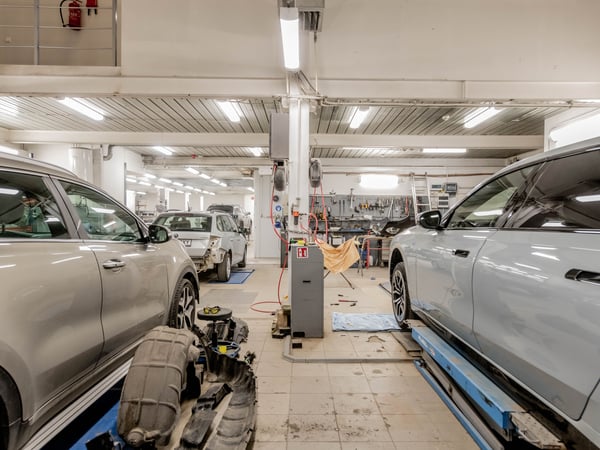 Interior of an automotive repair shop with cars