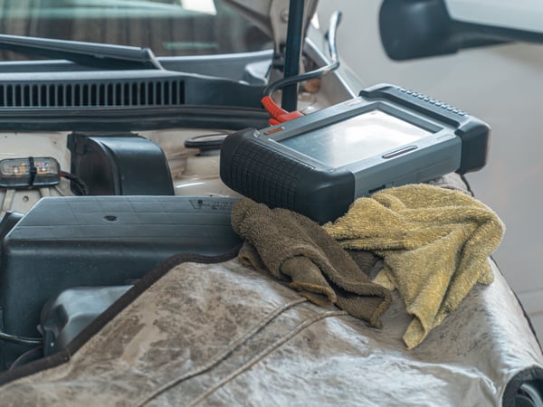 Close-up of car diagnostics tool on engine